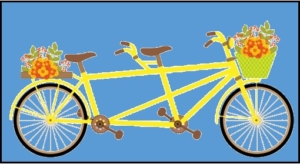 yellow tandem bicycle with flowers in baskets on the front and back